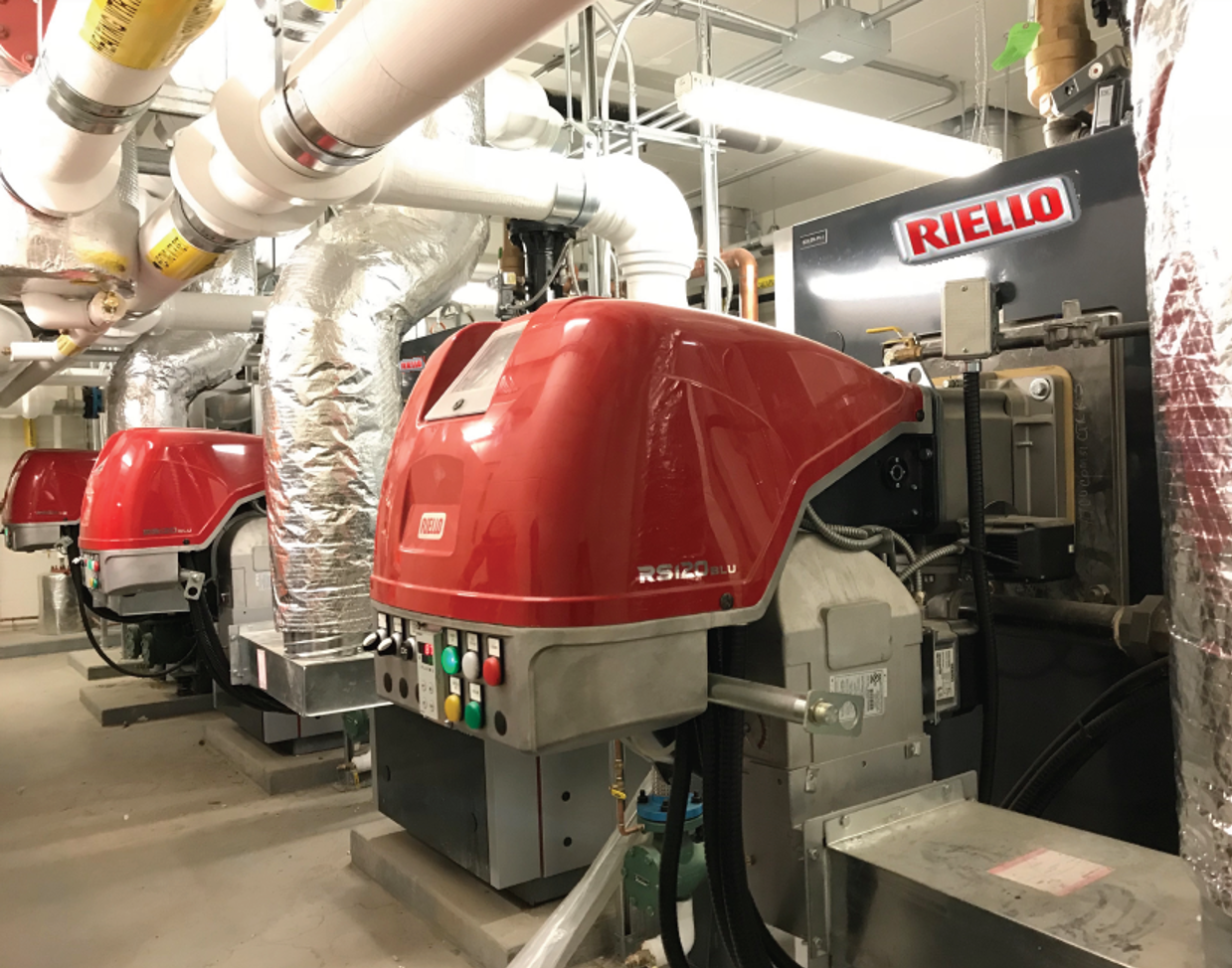 ATCO-Corporate Campus,
Commons Building Boiler #1-3 of 7.
Riello RTC-80-4700 High Mass
Condensing Boilers and RS-E
Linkageless Low-NOX Power Burners.